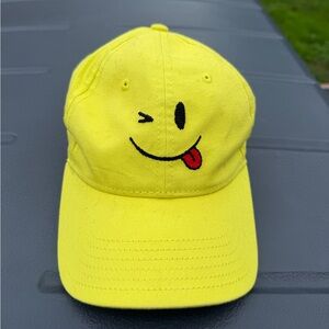 Yellow Smiley Face Cap by Opening Ceremony and Harding Lane. Needle point design